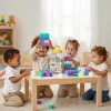 Kids playing with building blocks at table in Pakistan