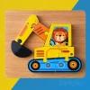 Close-up of thick wooden jigsaw puzzle pieces showing smooth edges and child-safe paint.