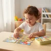 Toddler playing with farm animal puzzle educational toy in Pakistan