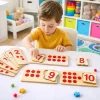 Toddler playing with wooden number matching puzzle educational toy in Pakistan