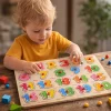 Toddler playing with wooden number peg puzzle educational toy in Pakistan