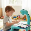 A young child using the dinosaur projector to trace an image on the desk.